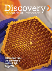 Discovery magazine cover with honeycomb-like golden hexagon-shaped device for detecting cosmic microwave background.